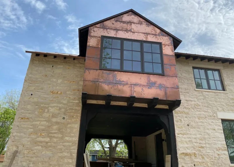 Copper metal panel facade on a stone building for Metal Roof Coating in Waipio Acres
